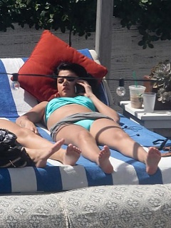 Photo set of kinky hottie Selena Gomez getting comfy in teal her bikini